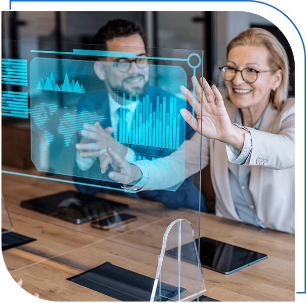 Two people interacting with transparent digital display.